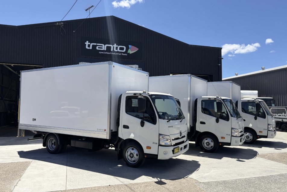 Three Tranto pantechs on Hino 300 Series chassis outside the Tranto shed at Coopers Plains