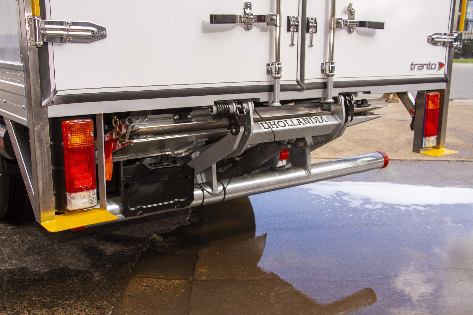 Dhollandia tuckaway loader stowed under the rear of a Tranto pantech